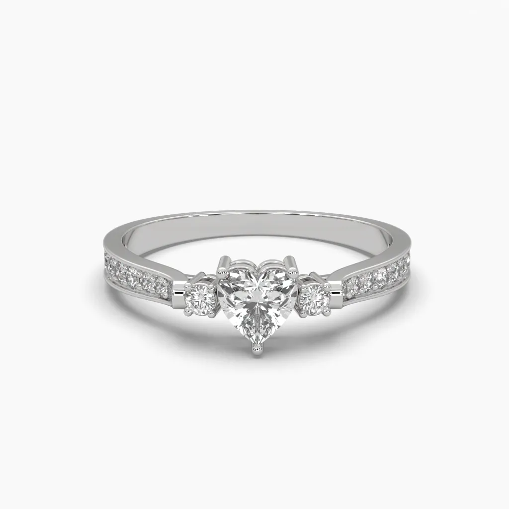 Anillo oro blanco 14k con circonia de corazon en el centro y circonias redondas laterales.