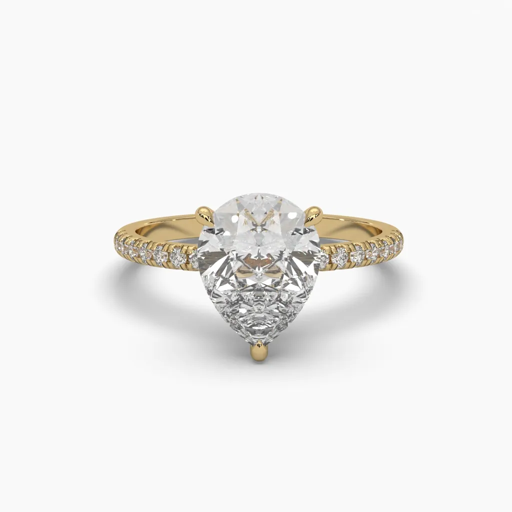 Anillo oro amarillo 14k con piedra central gota circonia.