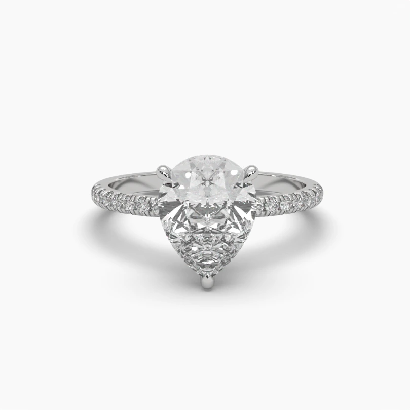 Anillo oro blanco 14k con piedra central gota monzonita.
