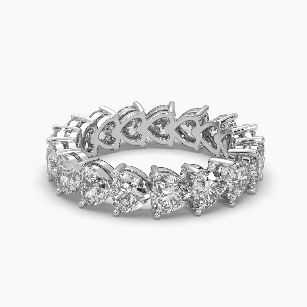 Churumbela oro blanco 14k con circonias corte corazon.