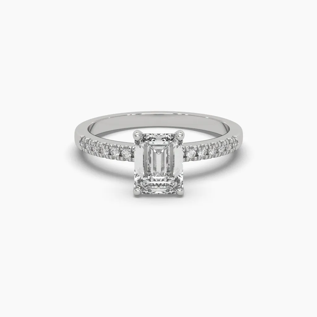 Anillo oro blanco 14k con circonia corte esmeralda y brazo con circonias redonda.