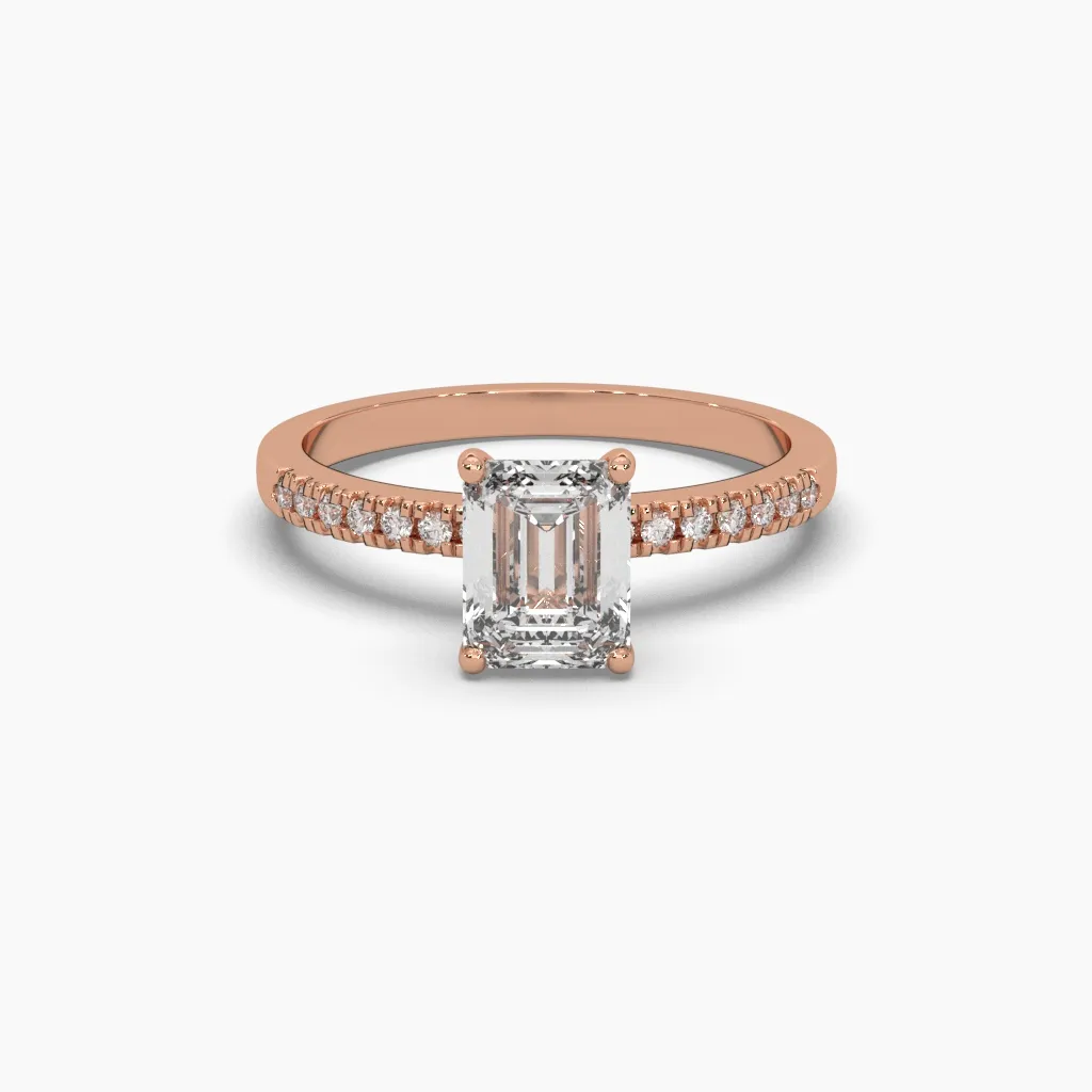Anillo oro rosa 14k con circonia corte esmeralda y brazo con circonias redonda.